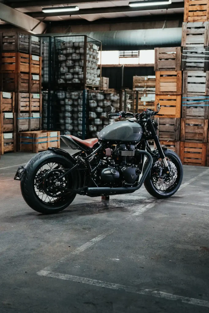 Close-up of Triumph 1200 Bobber engine with FCR Street exhaust and K&N filter
